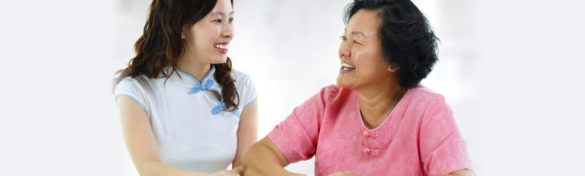 caregiver and elderly woman talking
