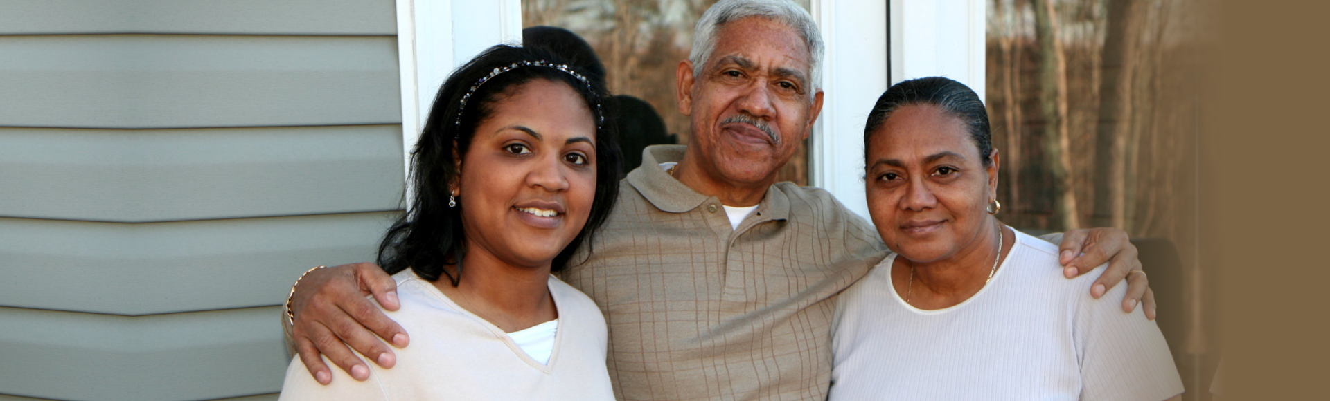 caregiver and elderly man smiling
